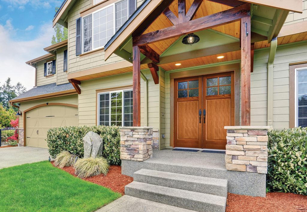 Luxurious home with large driveway.