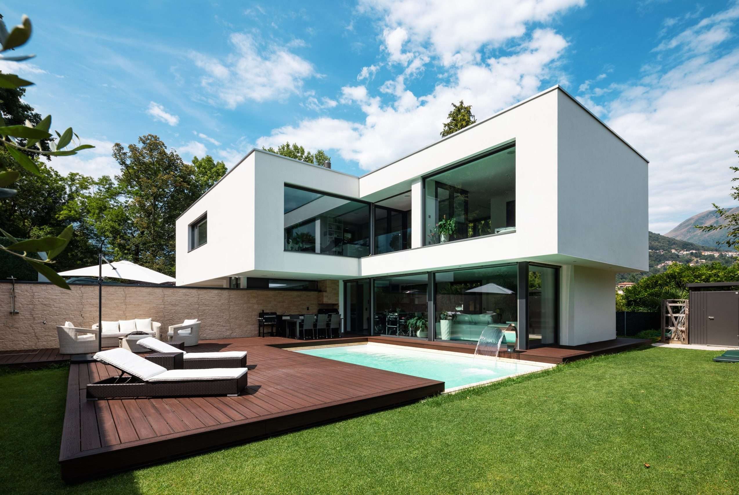 Exterior modern white villa with pool and garden