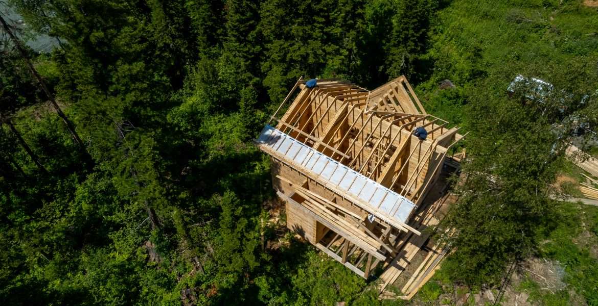 Aerial top view stages of construction houses wood build roof. New home framing