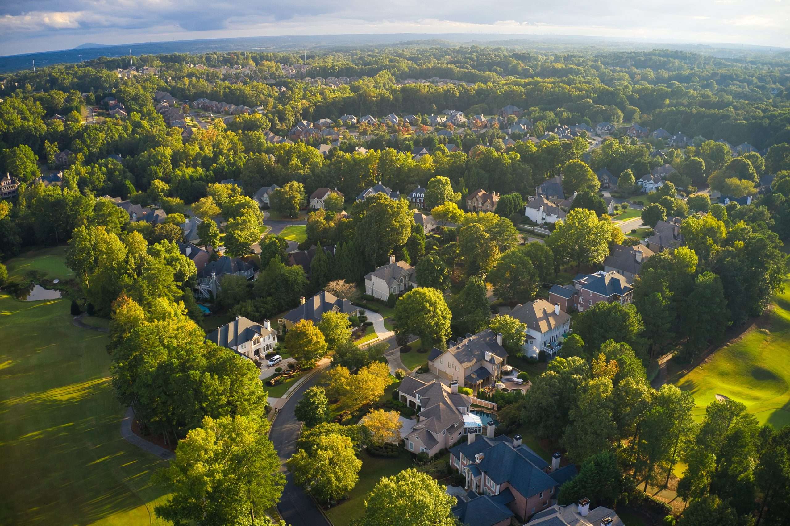 Aerial view of an upscale subdivision in suburbs of a city in USA