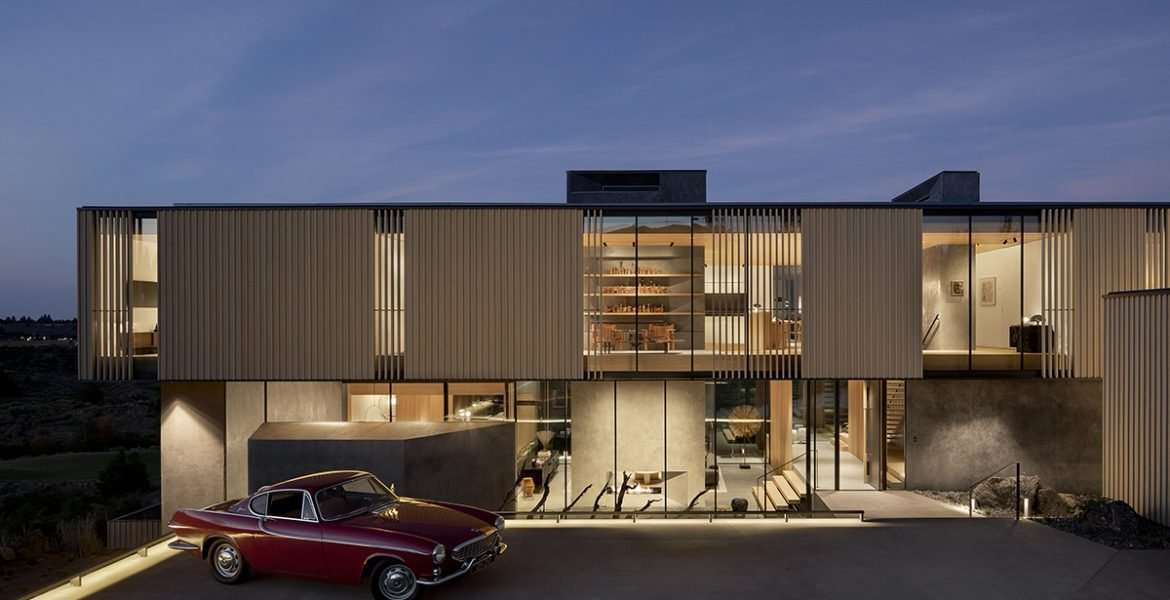 Tetherow Overlook exterior of modern home with red classic car
