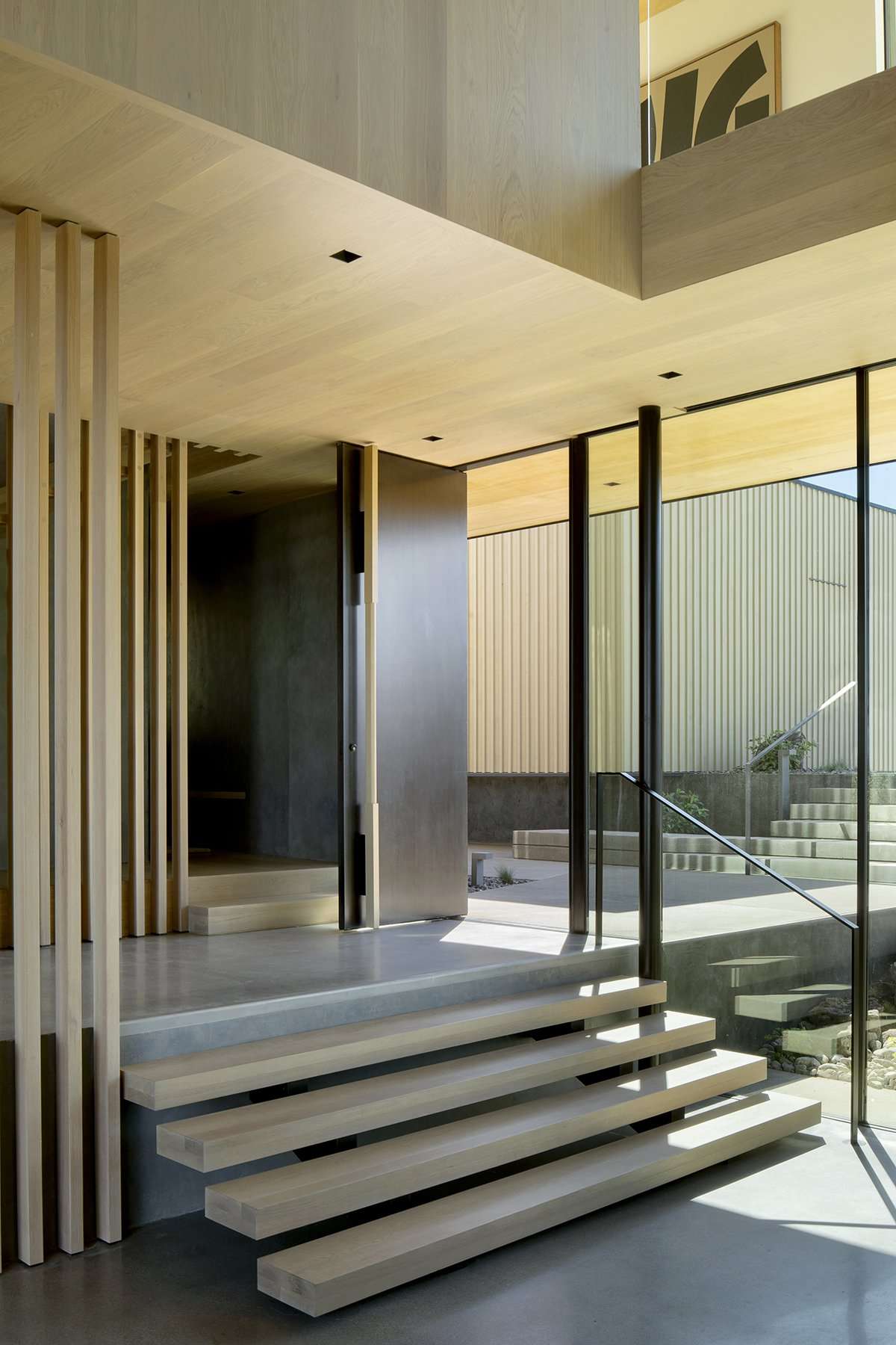 Four steps going to lower level of modern home