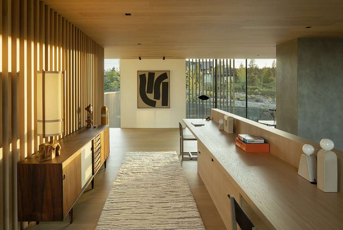 Sunlight filters through interior wood louvers