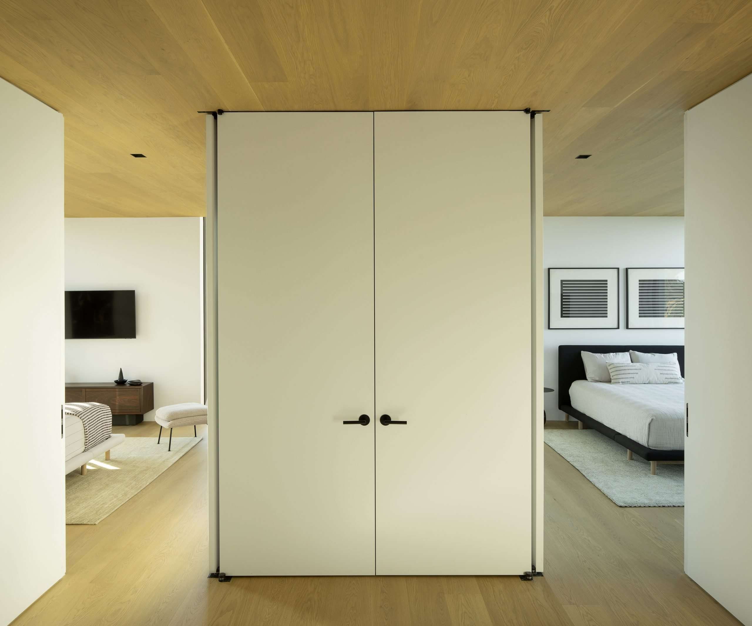 Pocket doors open onto side-by-side guest rooms