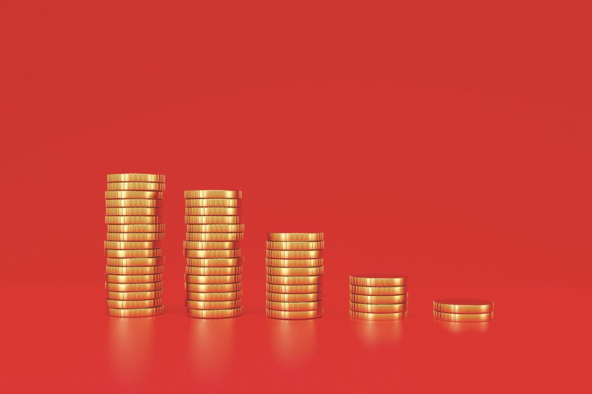 Coin stacks on panoramic red background. Financial market downturn, Inflation and stagflation concept. 3d rendering.