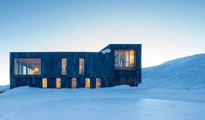 Kirigami House by Sparano + Mooney Architecture, a steel-clad mountain house in deep snow at Powder Mountain, Utah